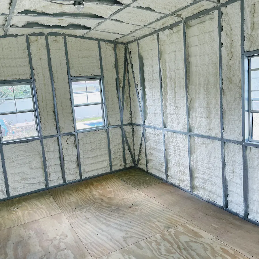 Closed-cell spray foam insulation applied to wall cavities in a residential project in Mena